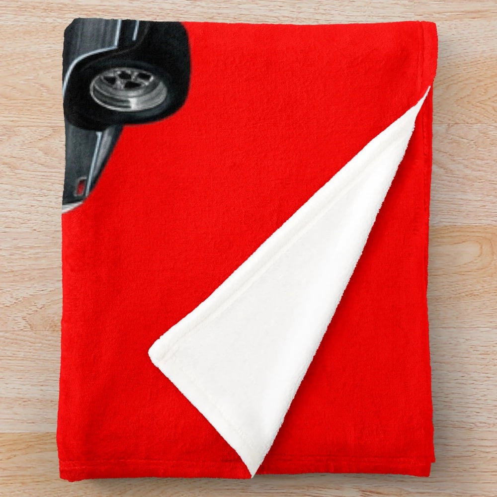 A plush blanket featuring the iconic Dodge Charger from the Fast and Furious movie franchise