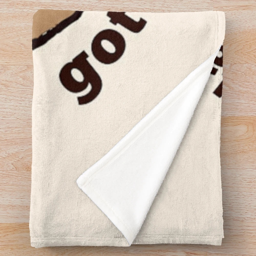 A cozy plush blanket featuring a popular quote from the TV show "New Girl