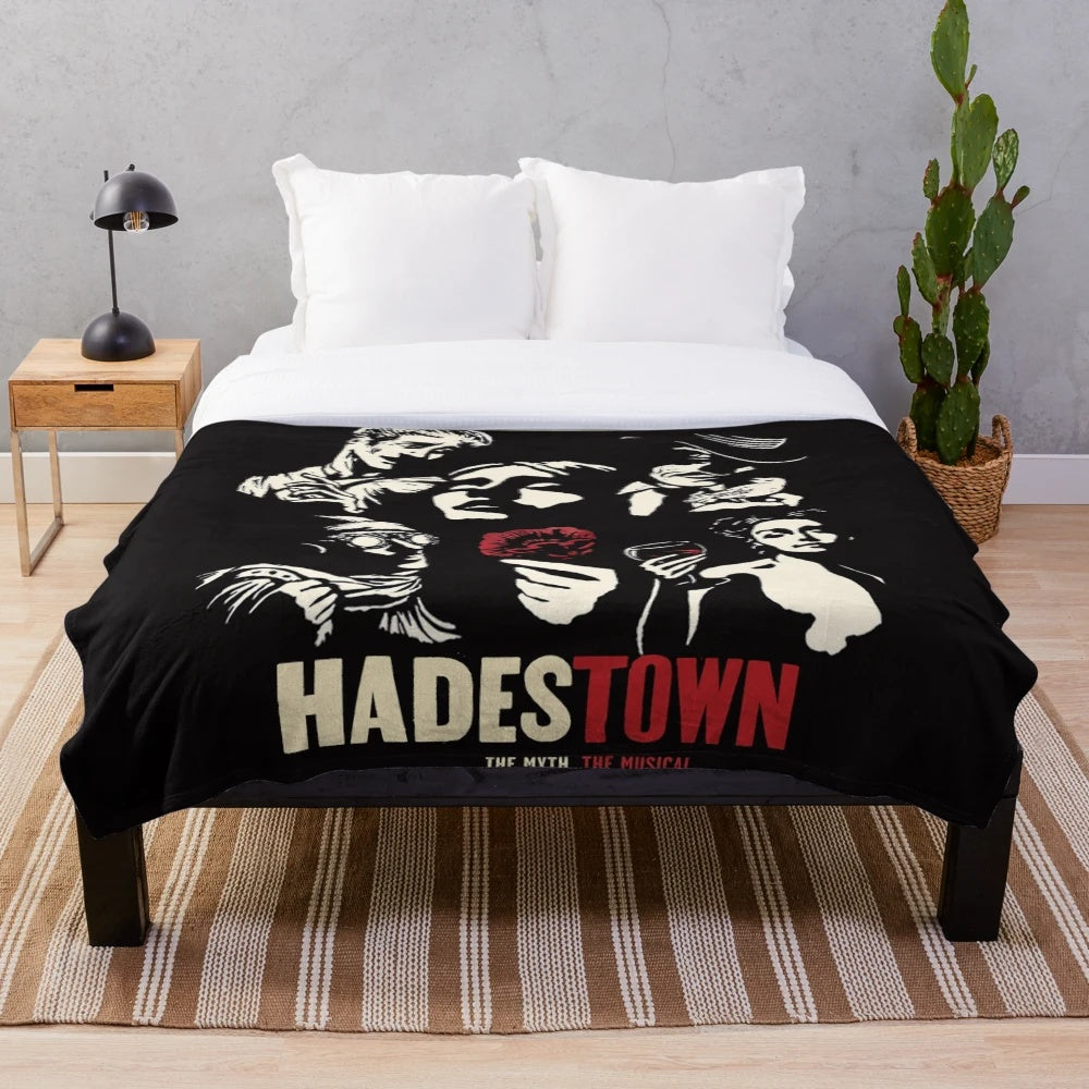 Hadestown-inspired plush blanket featuring key characters and symbols from the acclaimed musical