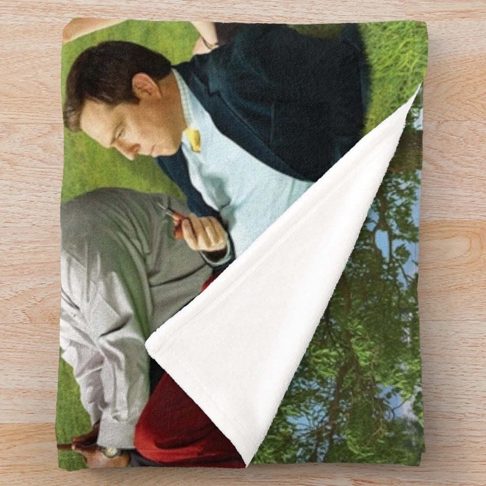 Seurat-inspired plush blanket featuring characters from the TV show The Office