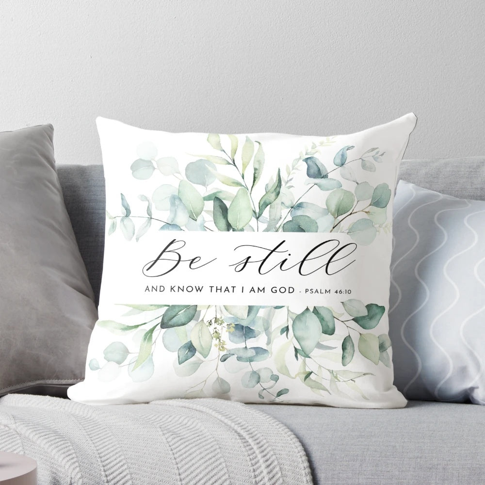 "Be Still" Christian wall decor pillow with Psalm 46:10 Bible verse and foliage design