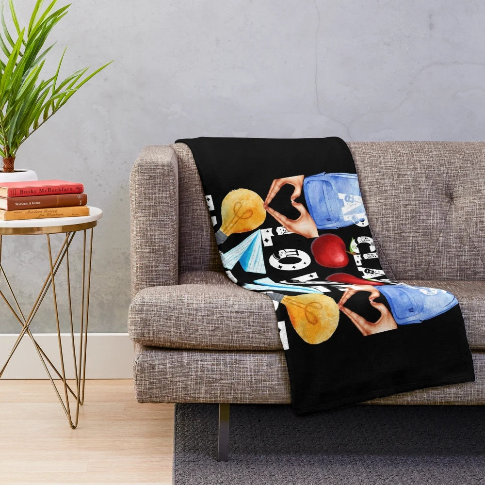 Plush blanket with "Teach, Love, Inspire" design, perfect for inspiring teachers and classrooms