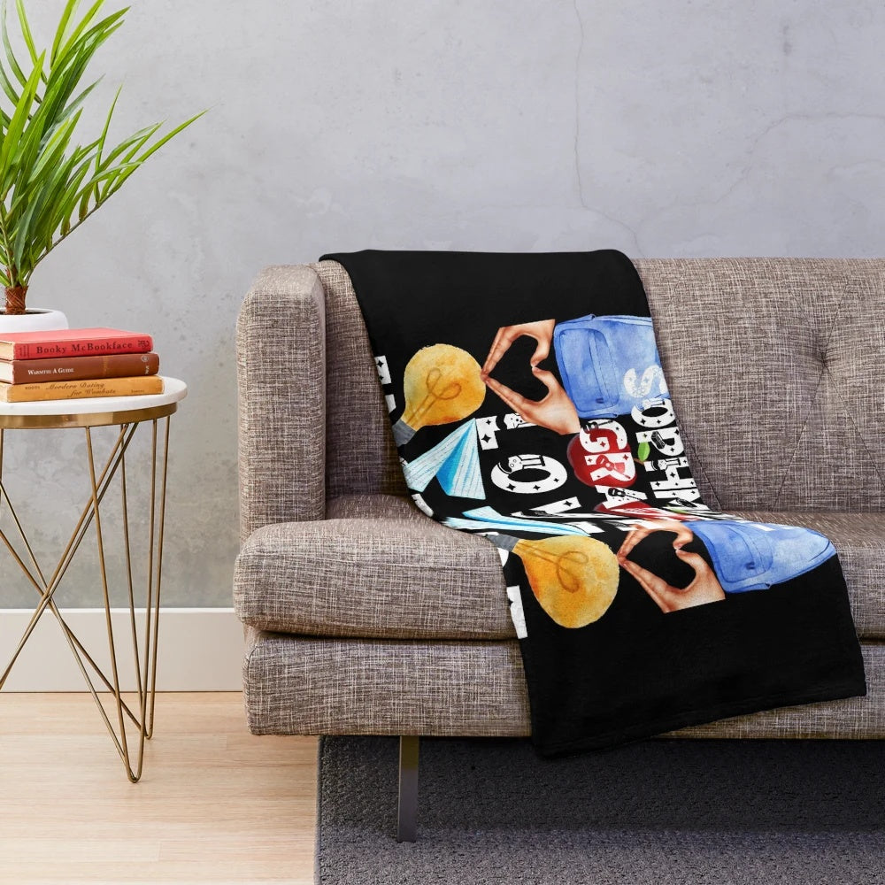 Plush blanket with text "teach love inspire" and "the future of the world is in my classroom