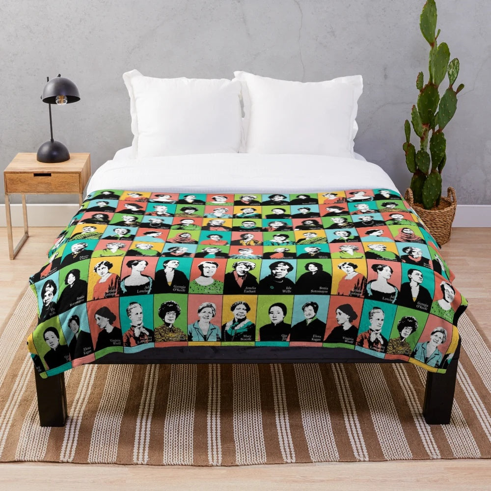 Plush blanket featuring illustrations of feminist icons like RBG, Jane Goodall, and Katherine Johnson