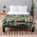 Plush blanket featuring illustrations of feminist icons like RBG, Jane Goodall, and Katherine Johnson