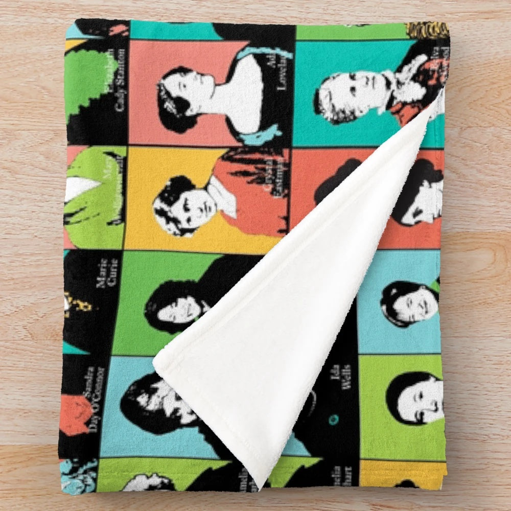 Plush blanket featuring illustrations of feminist icons like RBG, Jane Goodall, and Katherine Johnson