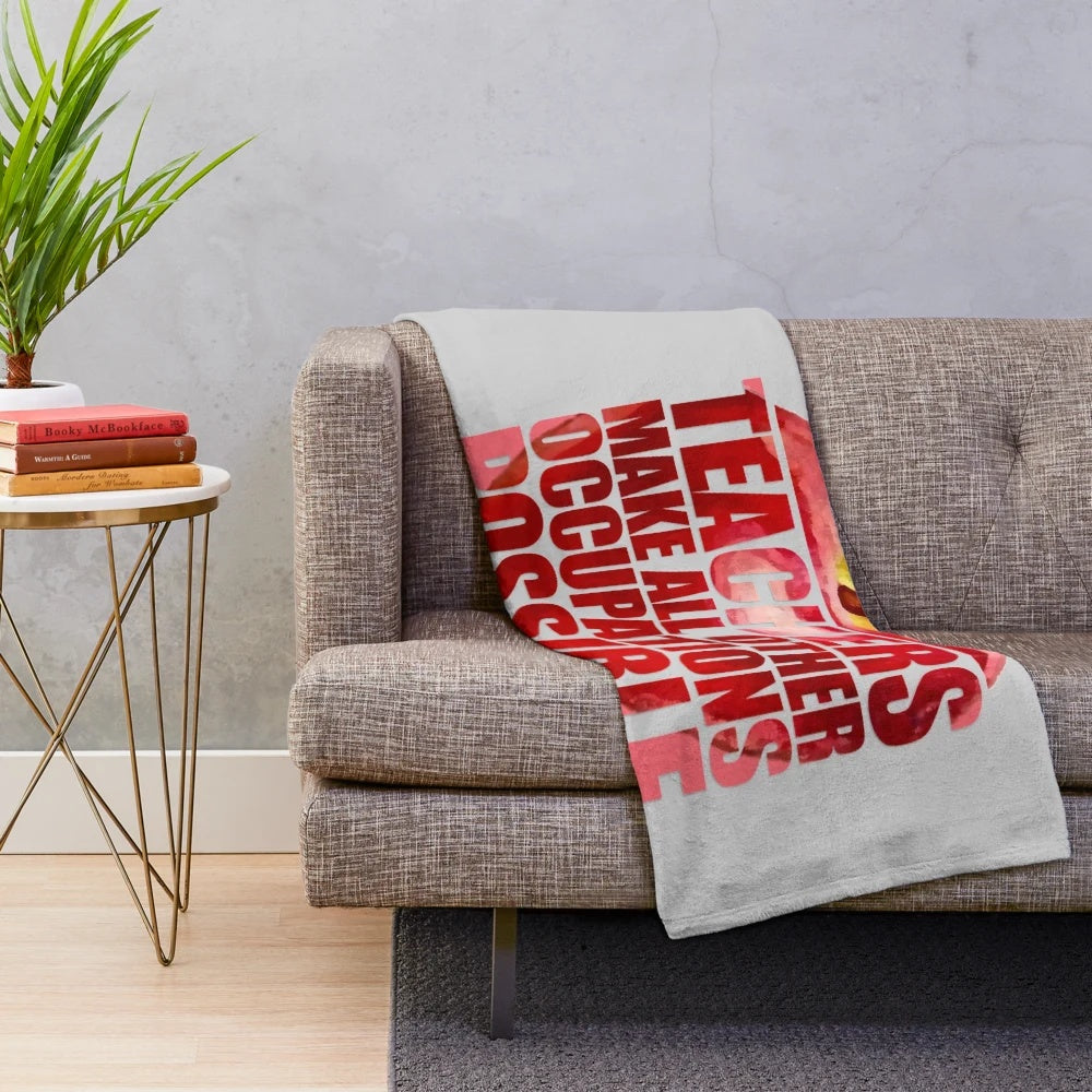 Plush blanket with "TEACHERS MAKE ALL OTHER OCCUPATIONS POSSIBLE" text and teaching-themed design
