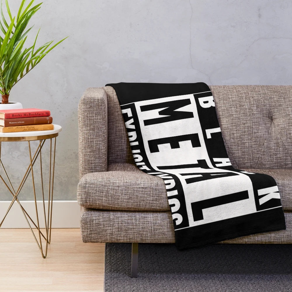 Heavy metal-themed plush blanket with guitar and dark imagery