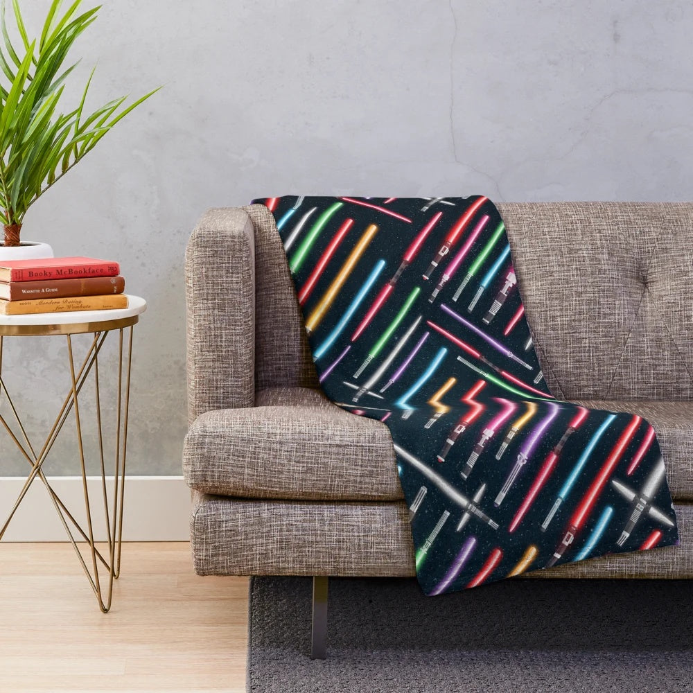 Lightsaber-themed plush blanket for sci-fi enthusiasts