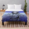 Plush blanket with a futuristic, cosmic design featuring robots, aliens, and psychedelic patterns