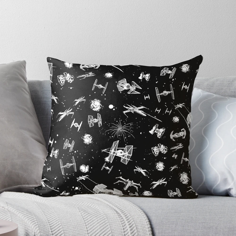 Colorful throw pillow featuring a space battle scene with spaceships and stars