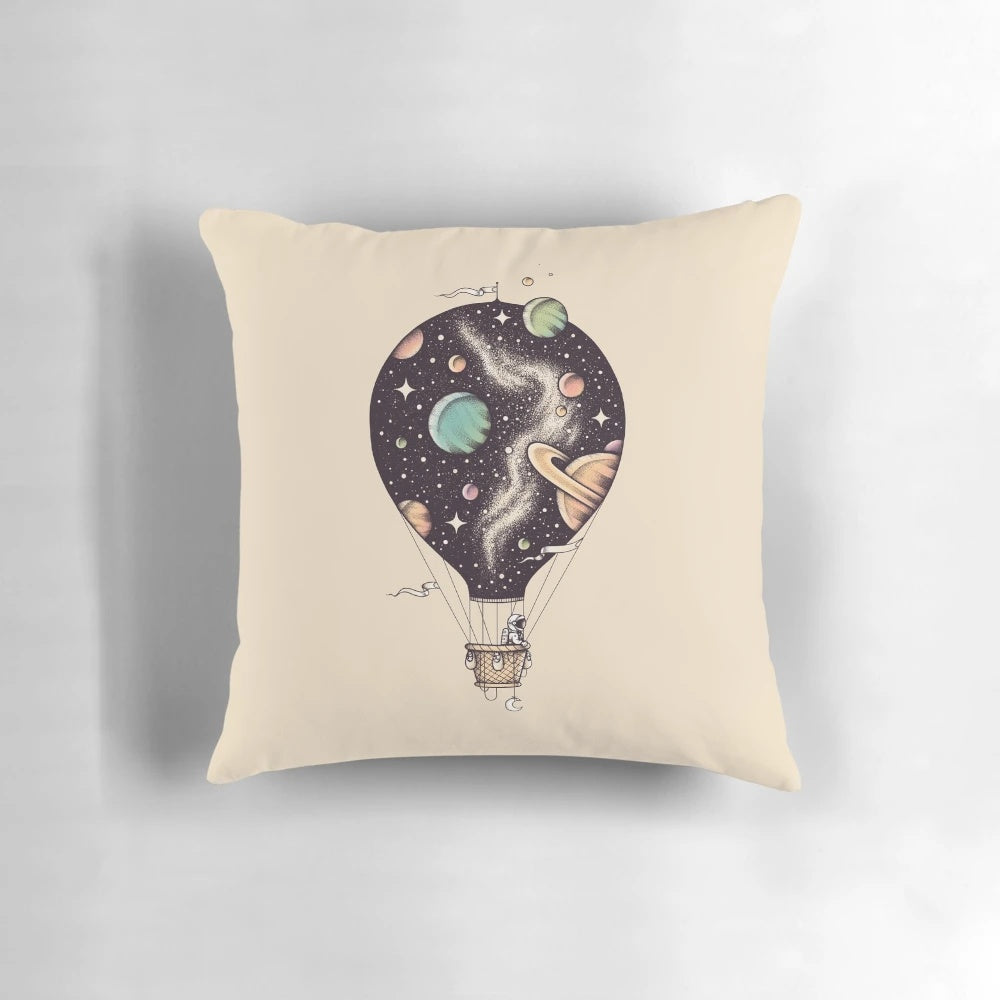 Interstellar Journey Pillow featuring a design of planets, stars, and a hot air balloon in space
