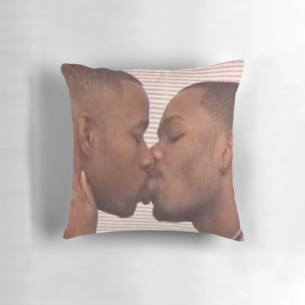 Two men of color sharing a loving embrace on a pillow
