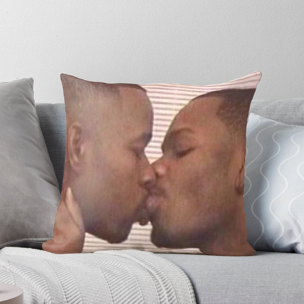 Two men of color sharing a loving embrace on a pillow