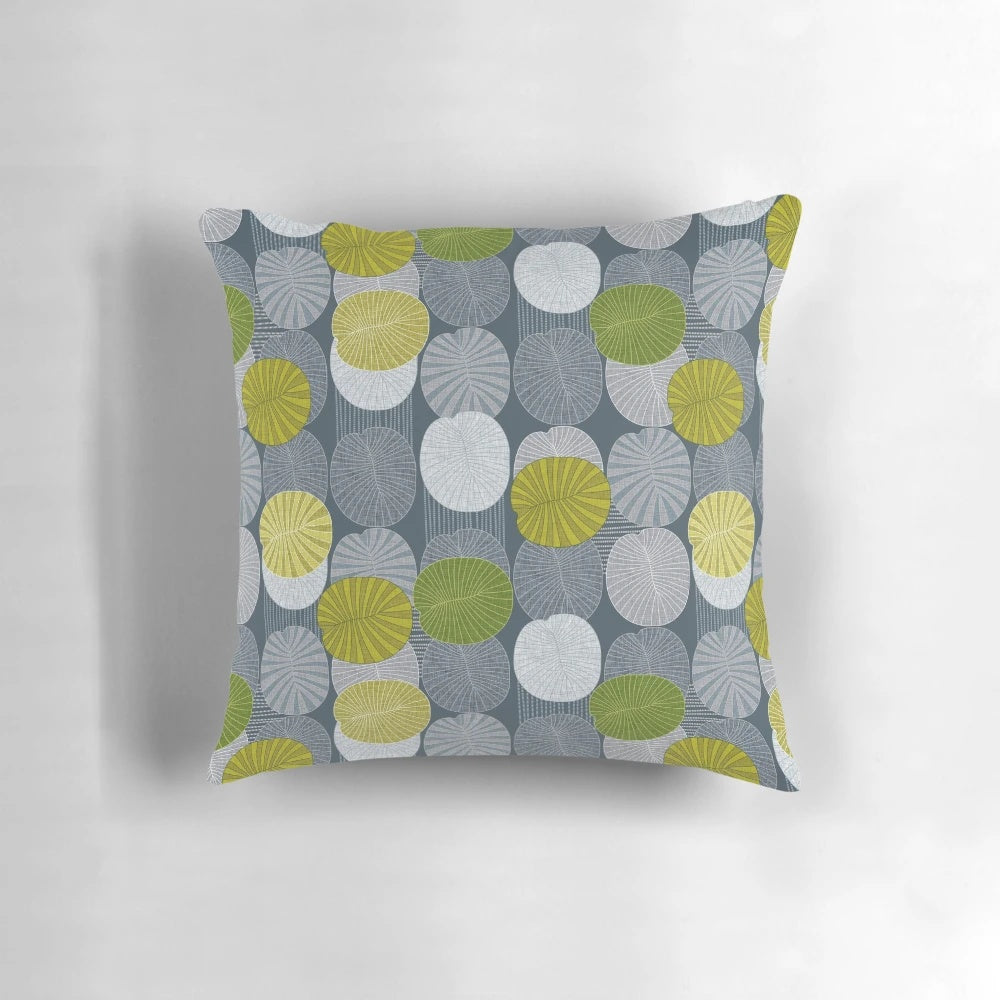 Lime-colored pillow featuring a fossil design inspired by the extinct Dickinsonia creature