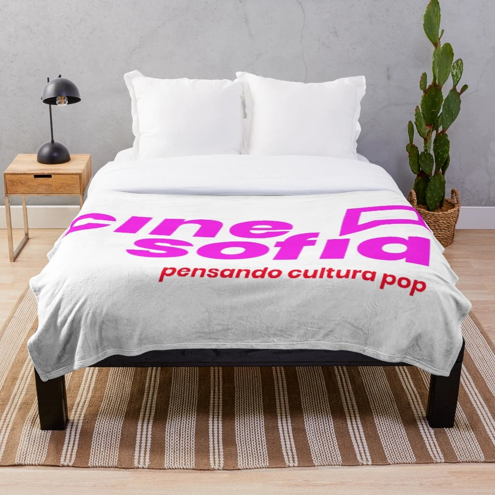 Plush blanket with geometric and nature-inspired patterns