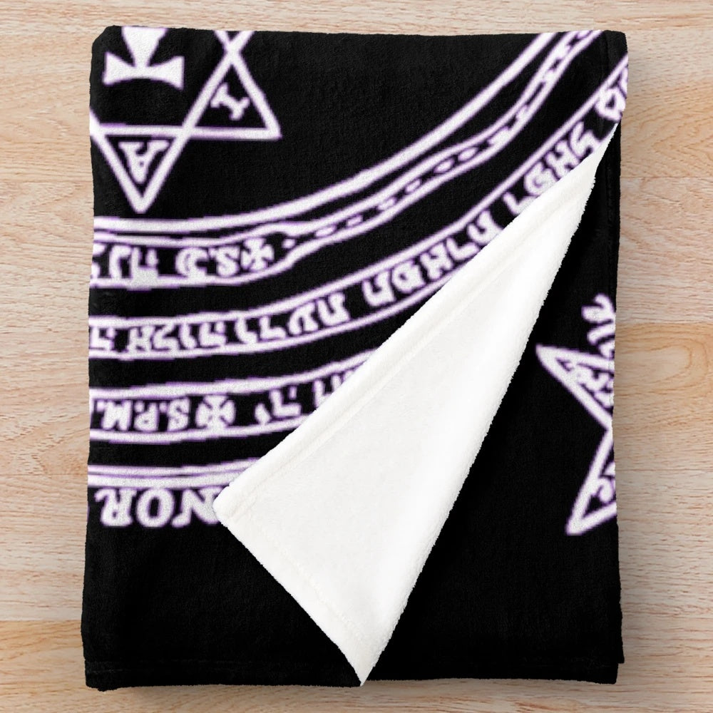 Inverted plush blanket featuring occult symbols and magical seals