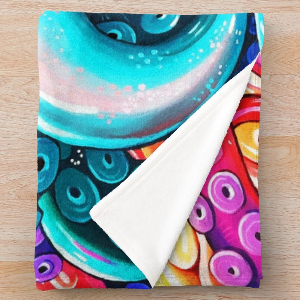 Colorful and mesmerizing glittery plush blanket featuring a vibrant octopus design
