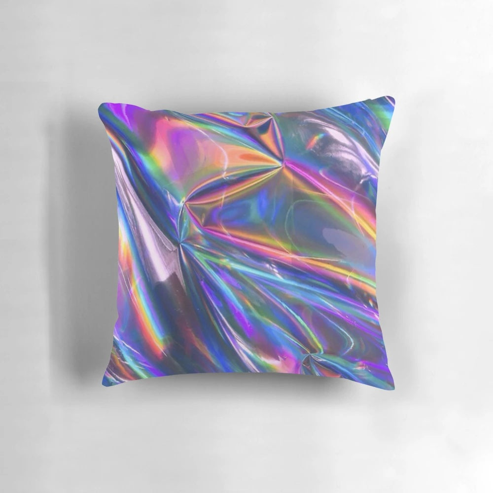 Holographic material pillow with a shimmering, rainbow-like texture
