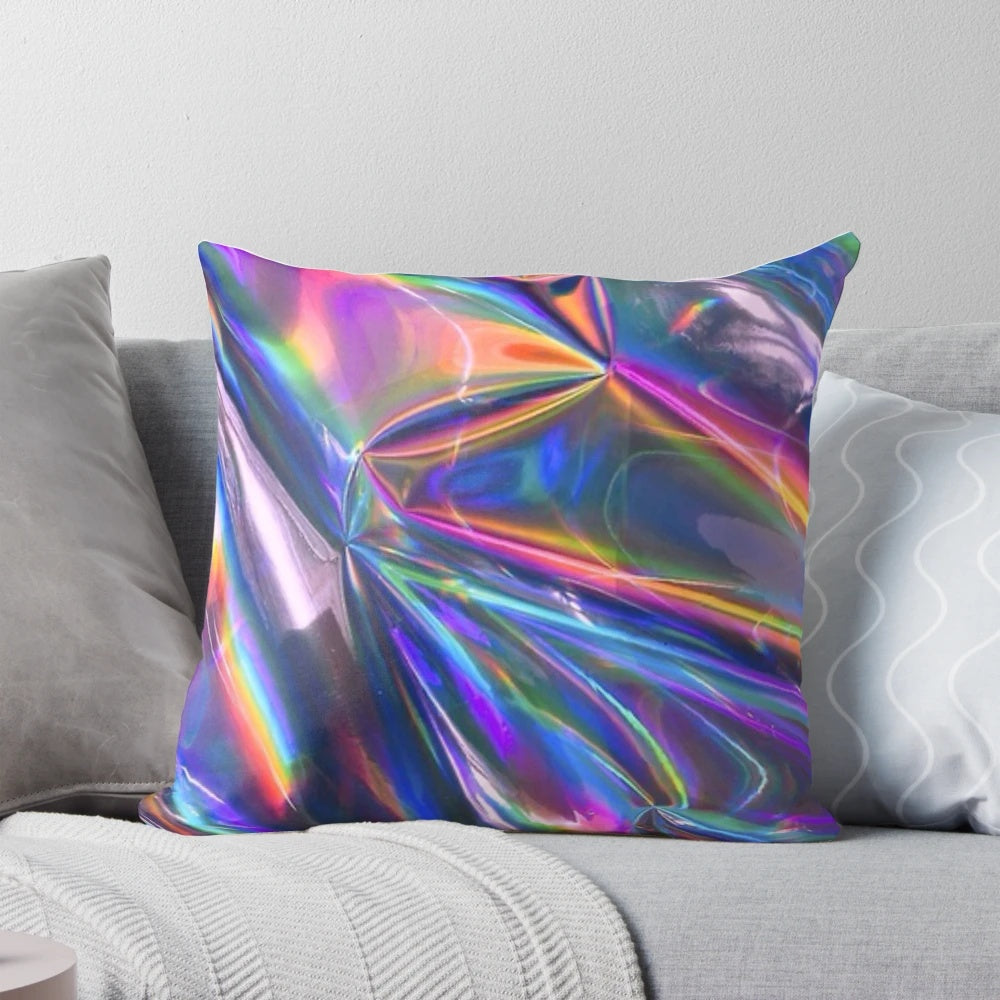 Holographic material pillow with a shimmering, rainbow-like texture