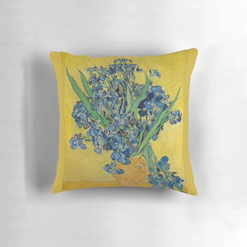 A decorative throw pillow featuring Vincent Van Gogh's iconic "Vase with Irises Against a Yellow Background" painting.