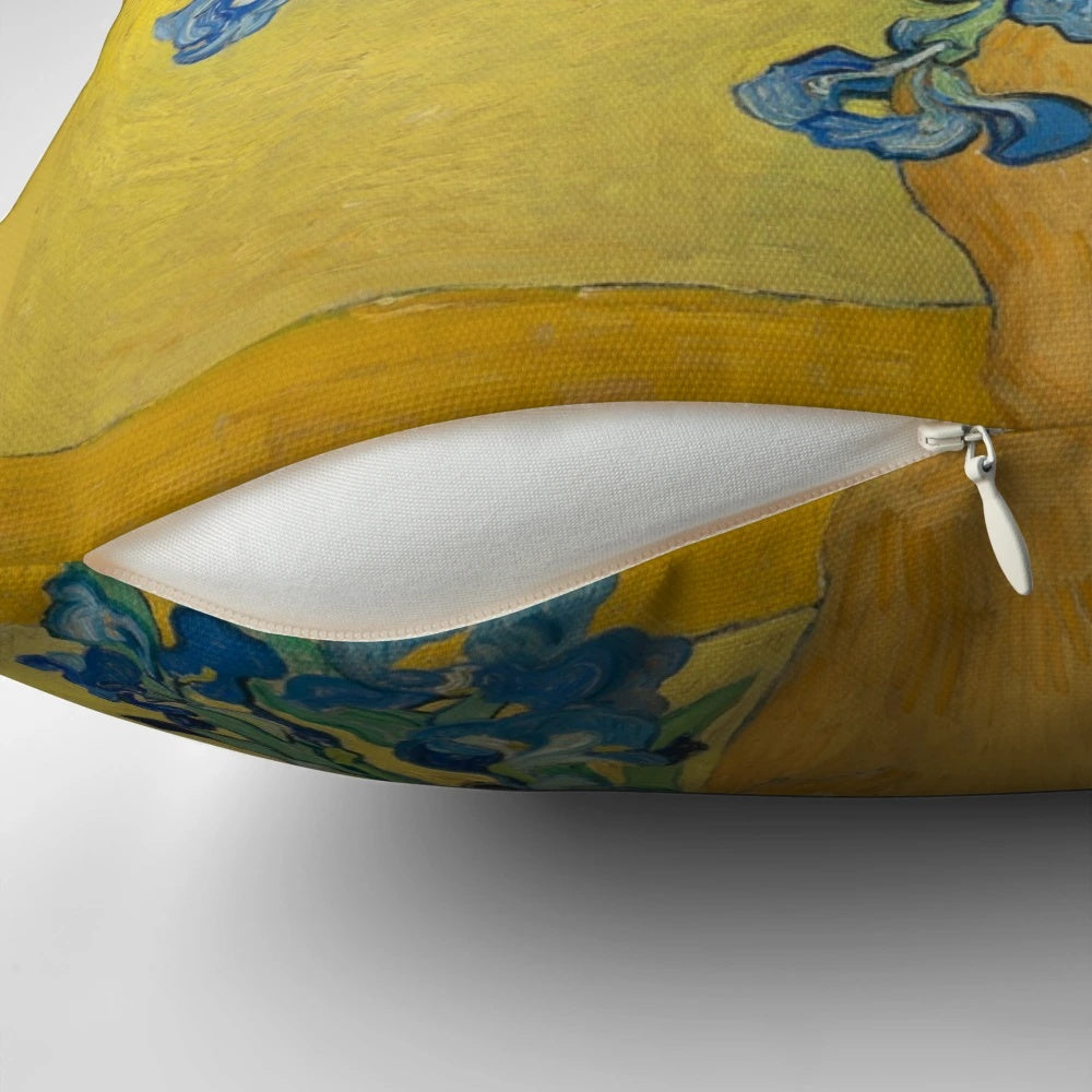 A decorative throw pillow featuring Vincent Van Gogh's iconic "Vase with Irises Against a Yellow Background" painting.