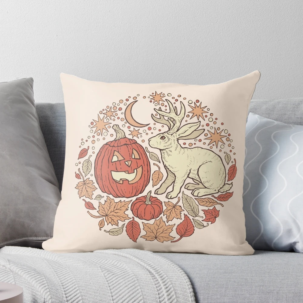 Pillow featuring a whimsical jackalope and jack-o-lantern in an autumnal scene, perfect for Halloween and fall decorating.