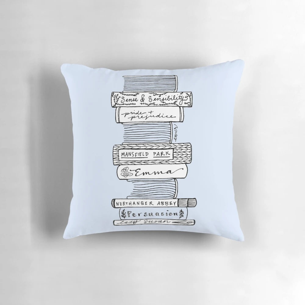 A black and white sketch-style pillow featuring characters and scenes from the works of Jane Austen.