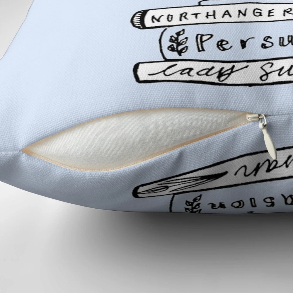 A black and white sketch-style pillow featuring characters and scenes from the works of Jane Austen.