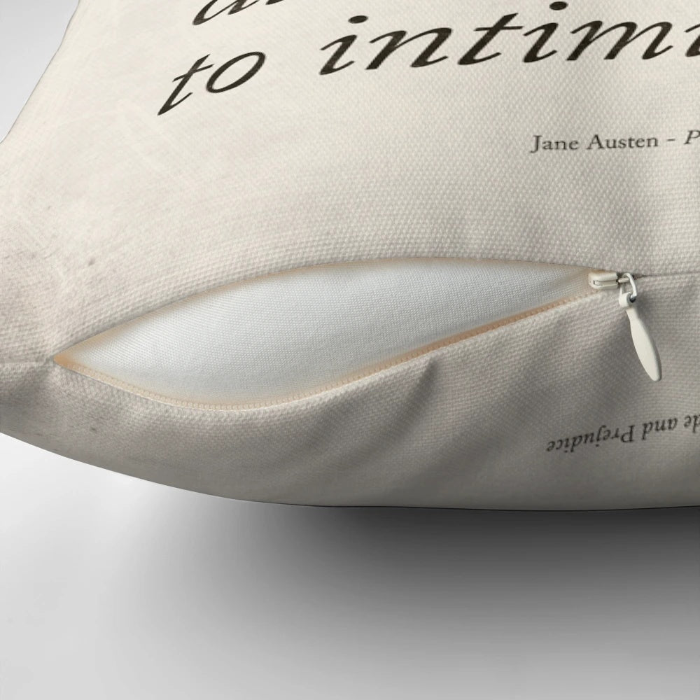 Jane Austen's 'Pride and Prejudice' literary quote printed on a black and white pillow for book lovers and home decor