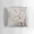 Japandi style pillow with subtle, painterly cherry blossom blooms