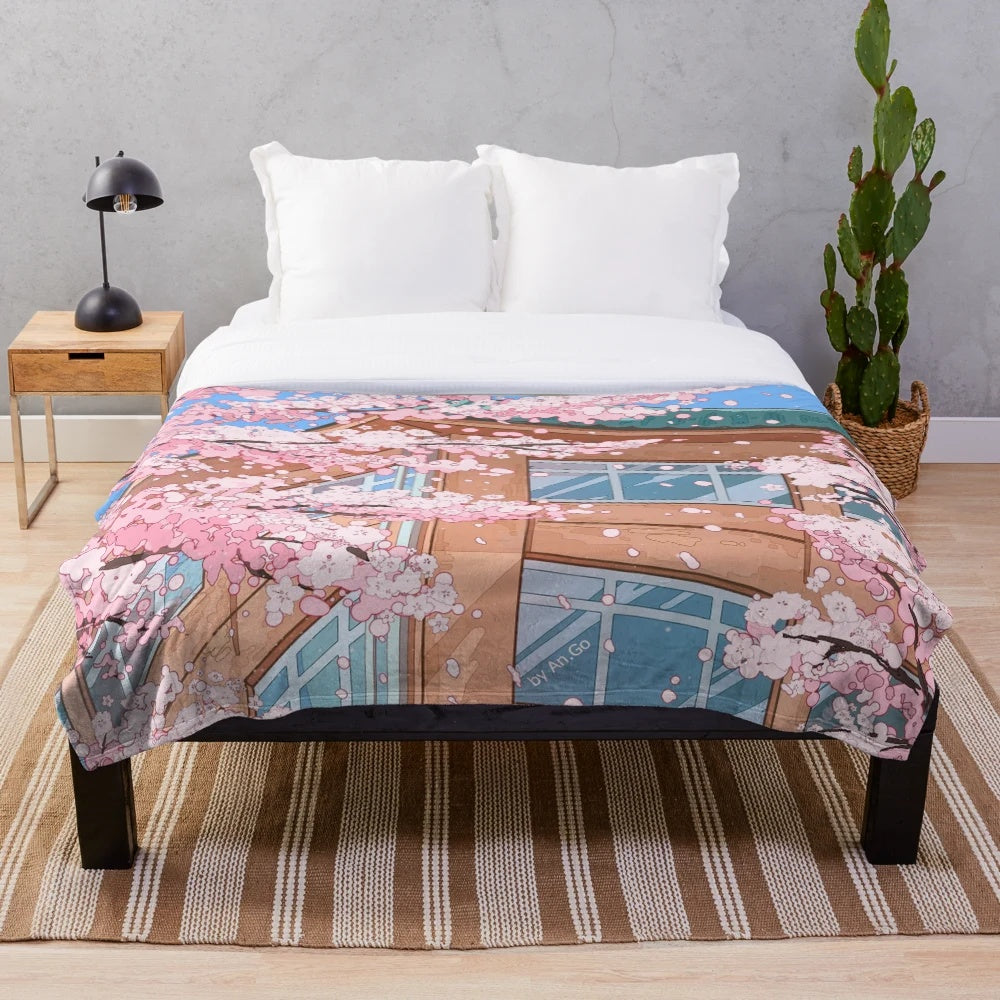 Japanese-inspired plush blanket featuring cherry blossom and urban scenery