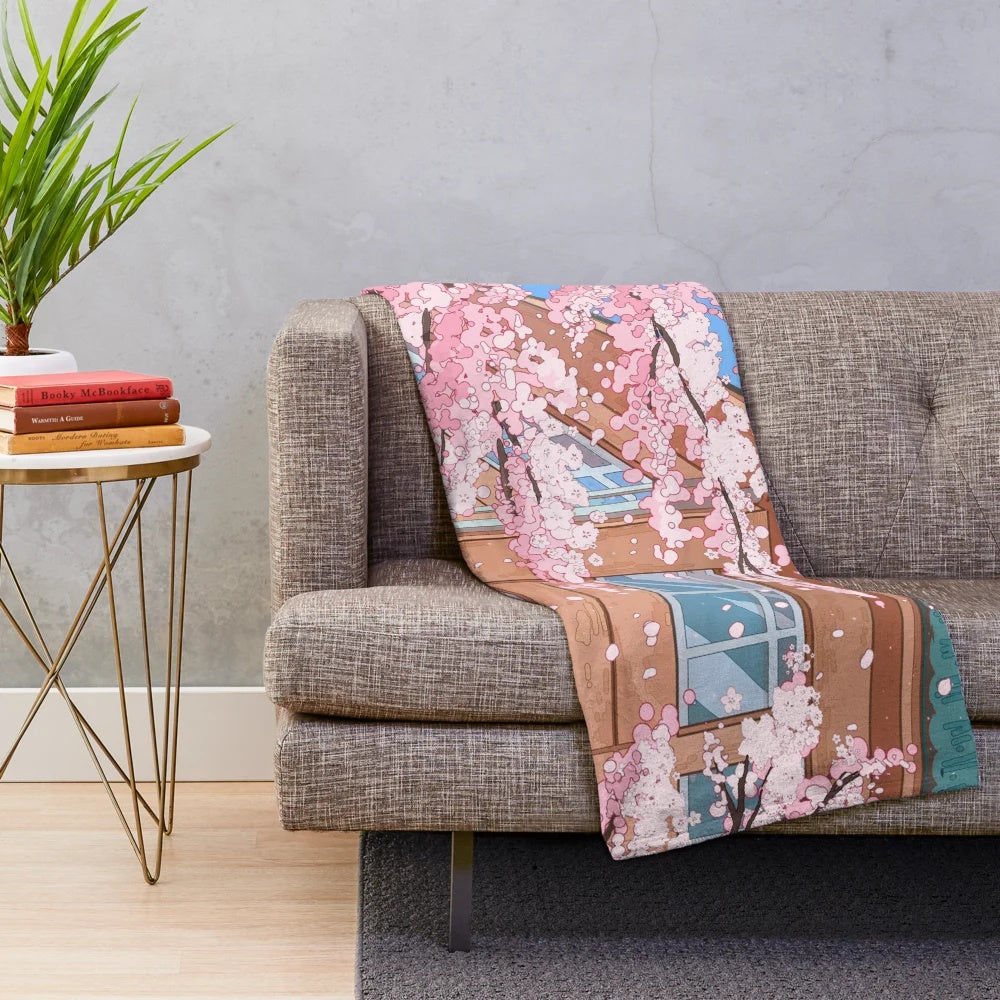 Japanese-inspired plush blanket featuring cherry blossom and urban scenery