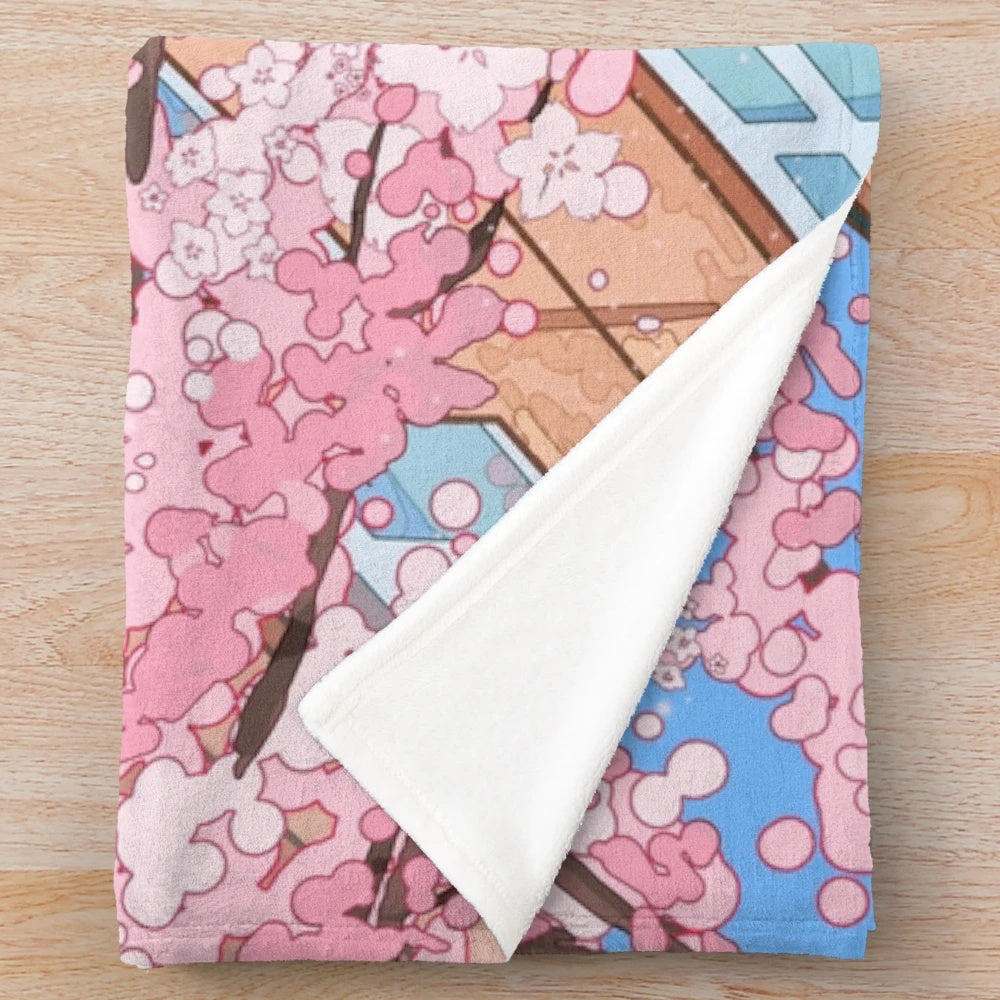 Japanese-inspired plush blanket featuring cherry blossom and urban scenery