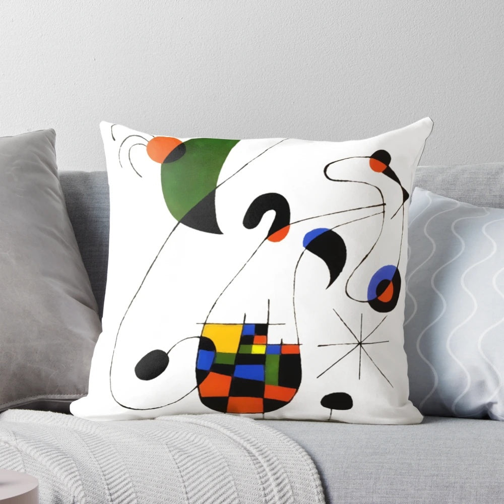 Decorative pillow featuring vibrant line art prints inspired by the famous Spanish painter Joan Miro