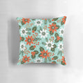 Festive Christmas floral pillow with poinsettias, holly, and snowy accents