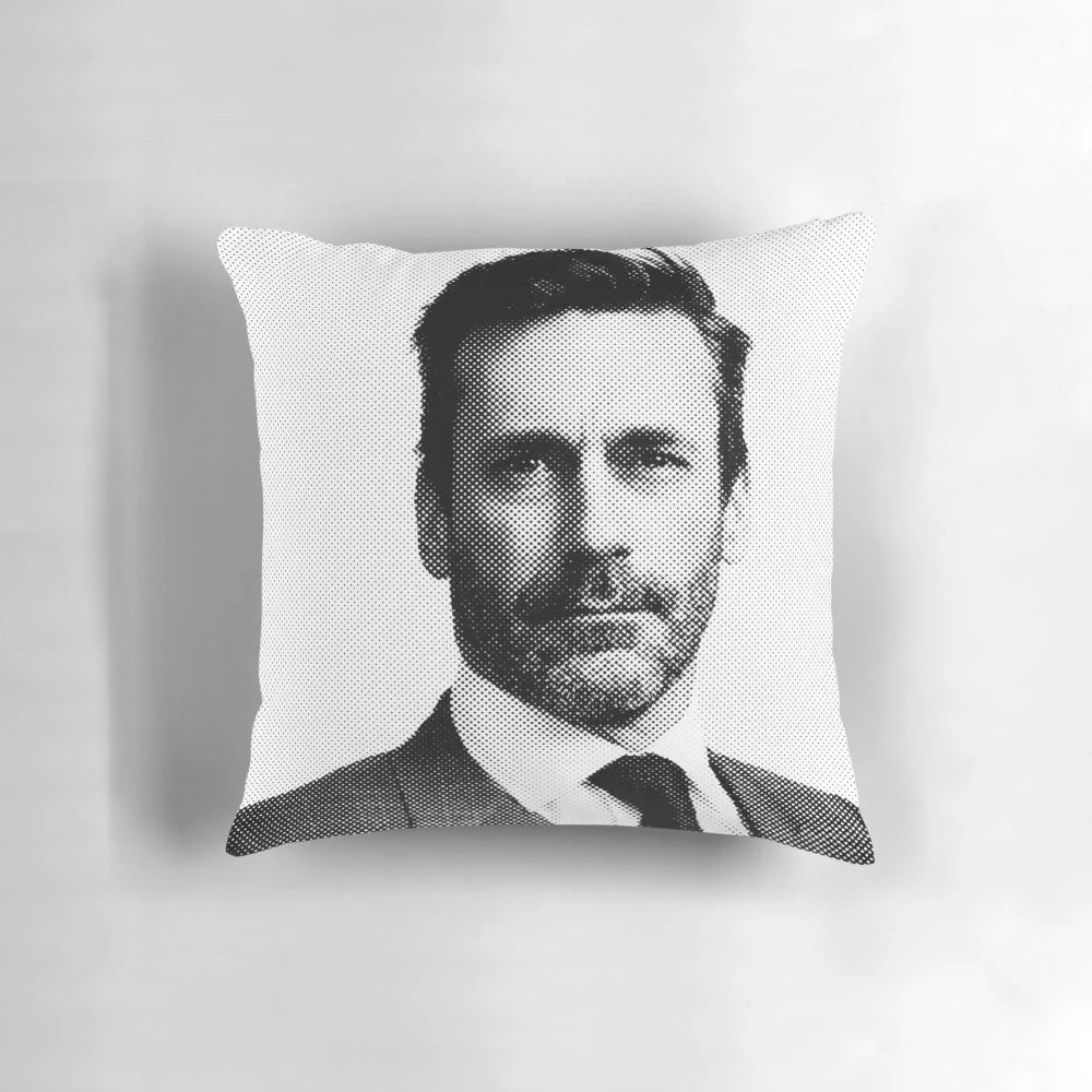 Pillow featuring a black and white portrait of actor Jon Hamm in a pointillist art style.