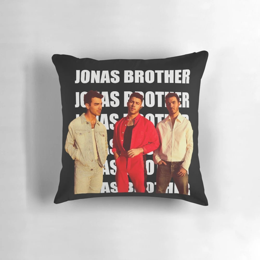 A plush pillow featuring the Jonas Brothers band members - Nick Jonas, Joe Jonas, and Kevin Jonas