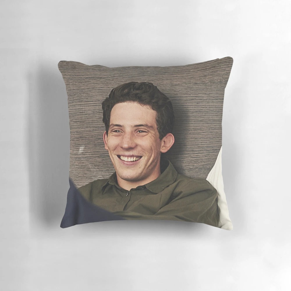 Josh O'Connor, star of "The Crown", depicted on a plush, comfortable pillow.