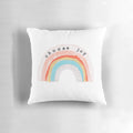 A colorful, decorative pillow featuring a "Choose Joy" design with rainbow colors and polka dots.