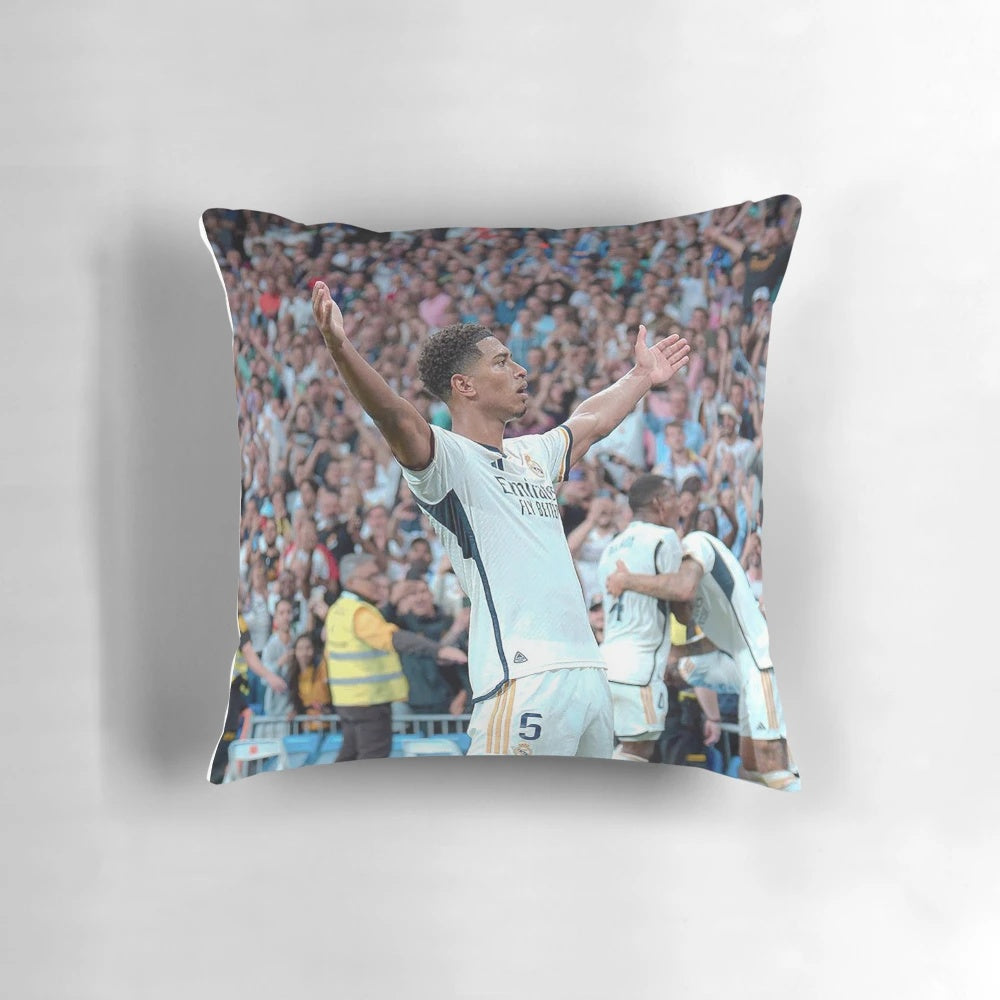 A decorative pillow featuring artwork of Jude Bellingham, the talented young footballer playing for Real Madrid.
