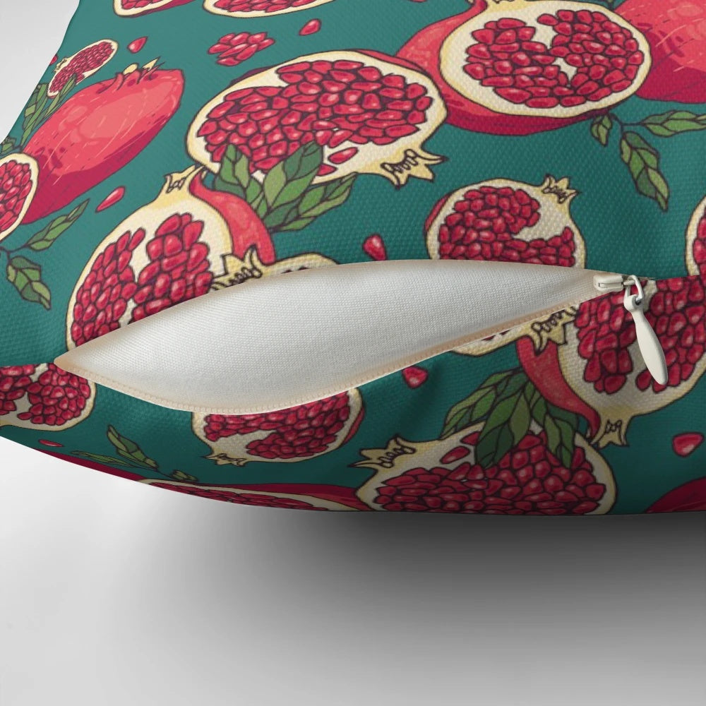 Vibrant pomegranate fruits printed on a plush decorative pillow