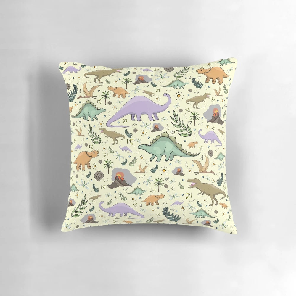 Soft, plush dinosaur pillow featuring a mix of popular prehistoric creatures like brontosaurus, triceratops, and tyrannosaurus rex.