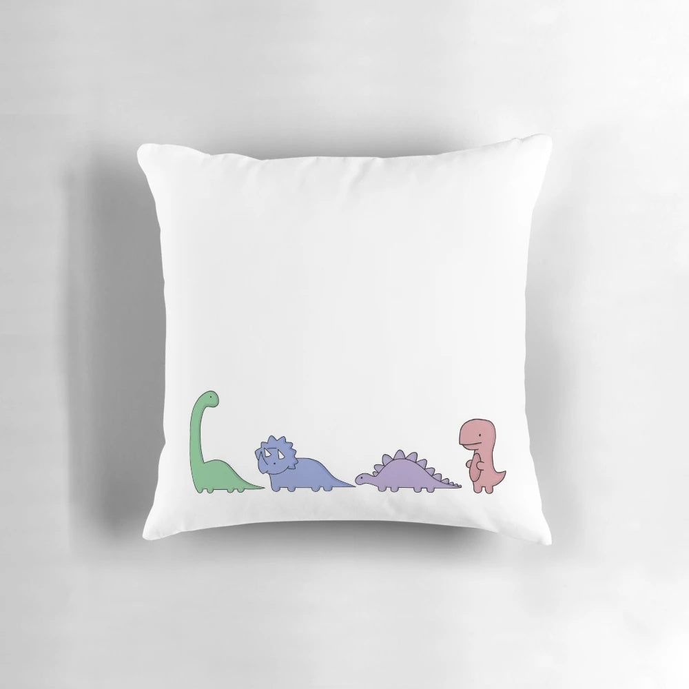 Colorful cartoon dinosaurs including brachiosaurus, T-rex, stegosaurus, and triceratops printed on a soft, comfortable pillow.