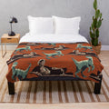Jurassic-themed plush blanket with DNA and dinosaur patterns