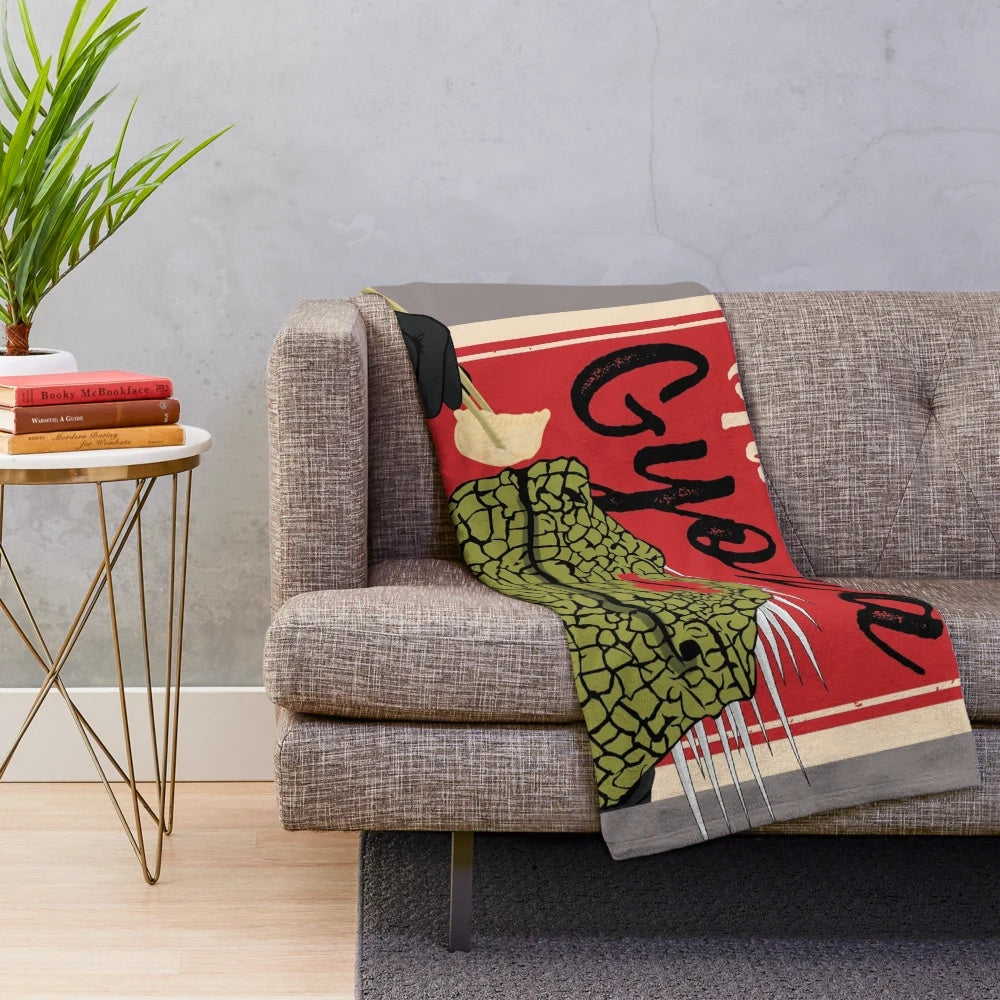 Kaiman the lizard-like character from the anime Dorohedoro eating gyoza on a plush blanket