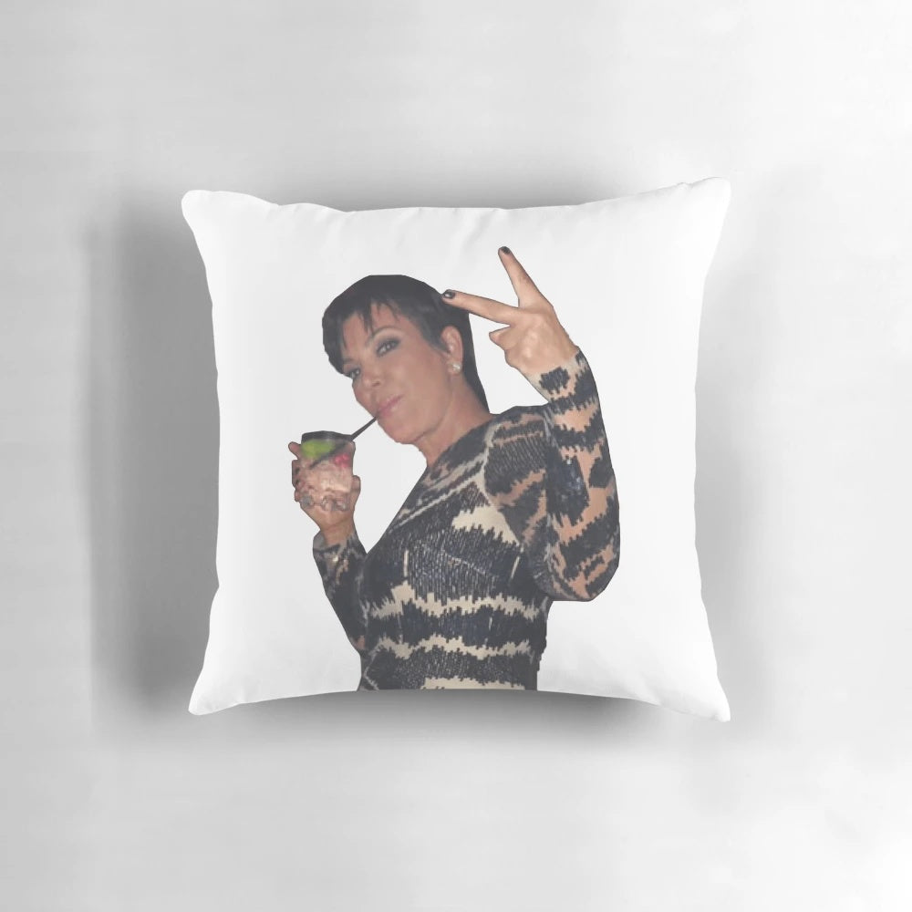 Decorative pillow featuring a peace sign design and the Kardashian family name