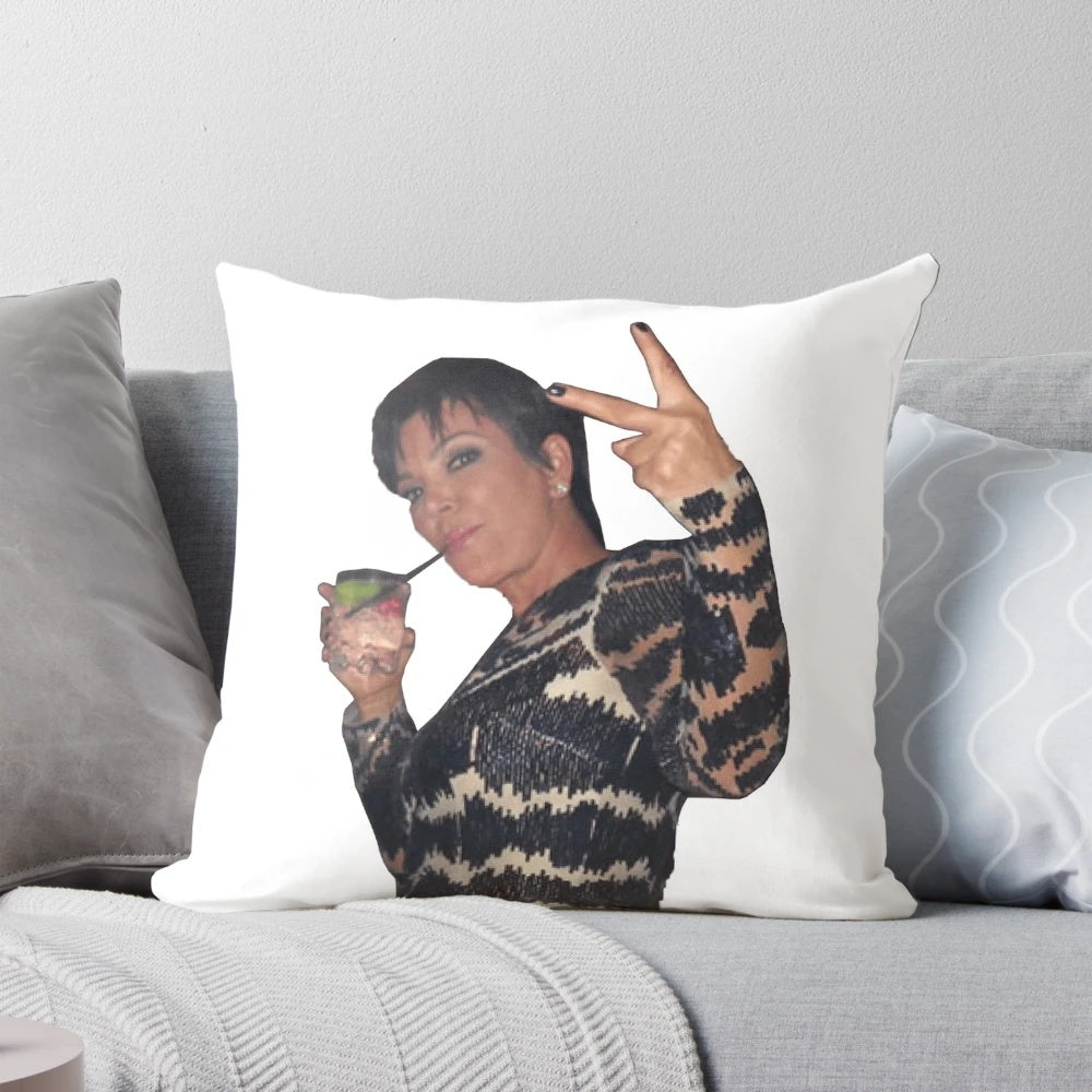 Decorative pillow featuring a peace sign design and the Kardashian family name