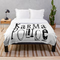 Karma Police themed plush blanket with band graphics and lyrics