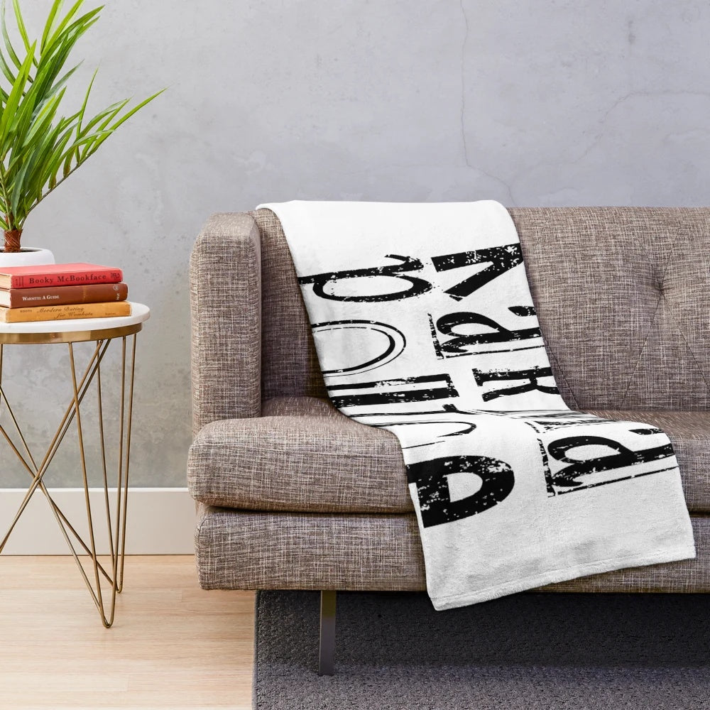 Karma Police themed plush blanket with band graphics and lyrics